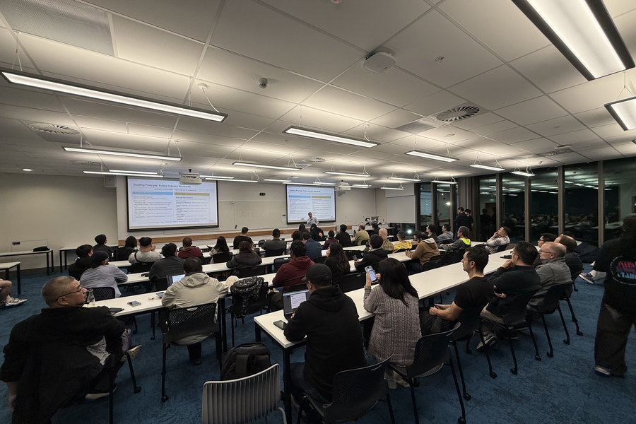 A talk in progress at a Physical AI Meetup