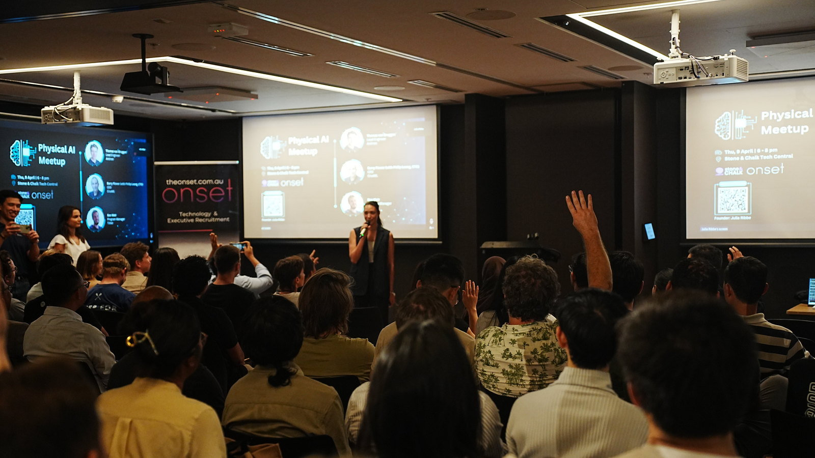 A full room of attendees at a Physical AI Meetup event